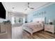 Comfortable main bedroom with decorative wall art and lots of natural light at 16697 Courtyard Loop, Land O Lakes, FL 34638