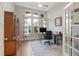 This home office features windows for plenty of natural light at 16697 Courtyard Loop, Land O Lakes, FL 34638