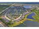 Gorgeous aerial view of a lakeside community featuring stunning homes and tranquil ponds at 1760 Fox Grape Loop, Lutz, FL 33558