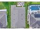 Aerial view features a well-maintained roof, a backyard, and surrounding landscaping at 1760 Fox Grape Loop, Lutz, FL 33558