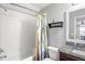 Bathroom with a shower-tub combination, modern fixtures, vanity and decorative shower curtain at 1760 Fox Grape Loop, Lutz, FL 33558