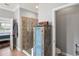 Bathroom featuring tile flooring, a glass shower, an antique blue cabinet, and the toilet at 1760 Fox Grape Loop, Lutz, FL 33558