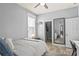 Bedroom featuring a modern decor and an ensuite bathroom at 1760 Fox Grape Loop, Lutz, FL 33558