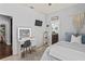 Charming bedroom with a vanity, tv, and ensuite bathroom at 1760 Fox Grape Loop, Lutz, FL 33558