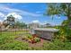 Well-maintained community center entrance with stone signage surrounded by lush greenery at 1760 Fox Grape Loop, Lutz, FL 33558