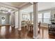 Spacious dining room featuring hardwood floors, modern lighting, and ample natural light at 1760 Fox Grape Loop, Lutz, FL 33558