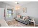 Inviting living room featuring comfortable seating and abundant natural light at 1760 Fox Grape Loop, Lutz, FL 33558