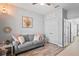 Light and airy living room with a comfortable couch and stylish decor at 1760 Fox Grape Loop, Lutz, FL 33558