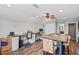 Well-lit office featuring wood-look floors, dual workstations, and a centrally located table at 1760 Fox Grape Loop, Lutz, FL 33558