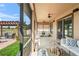 Spacious patio with multiple seating areas, lush greenery, and peaceful views at 1760 Fox Grape Loop, Lutz, FL 33558