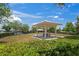 Exterior view of a community pavilion with a picnic table, offering a shaded outdoor space at 1760 Fox Grape Loop, Lutz, FL 33558