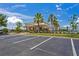 Clubhouse and pool area with ample parking and well-maintained landscaping at 1760 Fox Grape Loop, Lutz, FL 33558