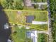 A captivating aerial view highlighting the property lines of this lakeside residence at 18102 Spencer Rd, Odessa, FL 33556