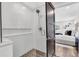 Modern bathroom featuring a frameless glass shower, hexagon tile floor, and subway tile walls at 18102 Spencer Rd, Odessa, FL 33556