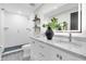 Stylish bathroom with double sink vanity, walk-in shower, and modern decor at 18102 Spencer Rd, Odessa, FL 33556