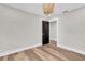 Bedroom with wood floors and view to the entrance of an additional room at 18102 Spencer Rd, Odessa, FL 33556