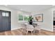 Well-lit dining room features stylish decor and access to the main entrance at 18102 Spencer Rd, Odessa, FL 33556