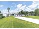 Charming home with a long driveway and well-manicured lawn at 18102 Spencer Rd, Odessa, FL 33556