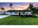 Charming home boasts a beautifully landscaped lawn and fresh exterior paint at 18102 Spencer Rd, Odessa, FL 33556