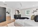 Well-lit main bedroom featuring a modern bed, stylish decor, and ample closet space at 18102 Spencer Rd, Odessa, FL 33556