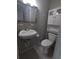 Clean, updated bathroom with modern fixtures, a toilet, and a mirrored medicine cabinet above the sink at 2004 Culberson Ave, Dunedin, FL 34698