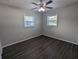 This bedroom is bright with lots of sunlight and plank flooring at 2004 Culberson Ave, Dunedin, FL 34698