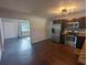 Eat-in kitchen featuring stainless steel appliances and modern lighting fixture at 2004 Culberson Ave, Dunedin, FL 34698