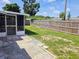 Spacious backyard with a wood fence and access to a screened in porch, perfect for relaxing or entertaining at 2051 Peggy Dr, Holiday, FL 34690