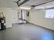 View of the garage with water heater and HVAC unit at 2051 Peggy Dr, Holiday, FL 34690