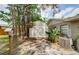 View of a backyard shed and side of the house with an air conditioner and privacy fence at 22154 Weeks Blvd, Land O Lakes, FL 34639