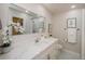 Stylish bathroom showcasing a white vanity with marble countertop and updated fixtures at 22154 Weeks Blvd, Land O Lakes, FL 34639
