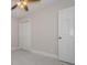 A simply decorated bedroom featuring carpeted floors and white trim at 22154 Weeks Blvd, Land O Lakes, FL 34639