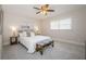 Cozy bedroom featuring a queen bed, neutral tones, and natural light from the window at 22154 Weeks Blvd, Land O Lakes, FL 34639
