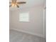 Clean bedroom with a ceiling fan and a view from the window at 22154 Weeks Blvd, Land O Lakes, FL 34639
