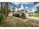 Charming single-story home with a two-car garage, shed, and well-maintained landscaping at 22154 Weeks Blvd, Land O Lakes, FL 34639