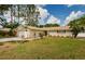Well-maintained lawn and charming single-story exterior, featuring an attached two-car garage at 22154 Weeks Blvd, Land O Lakes, FL 34639