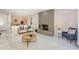 Inviting living room with stone fireplace, modern furniture, and open layout to dining area at 22154 Weeks Blvd, Land O Lakes, FL 34639