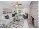 Sunlit living room featuring a decorative fireplace and sliding doors to the backyard at 22154 Weeks Blvd, Land O Lakes, FL 34639