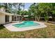 Inviting backyard featuring a pristine pool and screened-in lanai, perfect for outdoor enjoyment at 22154 Weeks Blvd, Land O Lakes, FL 34639