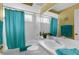 Bright bathroom showcasing a blue shower curtain, large mirror, and vanity with modern sink at 2585 Waterfall Dr, Spring Hill, FL 34608
