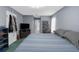 Comfortable bedroom featuring neutral wall paint, carpet and a large window at 2585 Waterfall Dr, Spring Hill, FL 34608