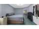 Cozy bedroom with a comfortable bed, soft blue walls and private balcony access at 2585 Waterfall Dr, Spring Hill, FL 34608