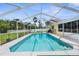 Backyard pool with screened lanai and plenty of space for outdoor enjoyment at 2585 Waterfall Dr, Spring Hill, FL 34608