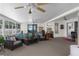 Inviting sunroom with large windows, comfortable seating, and plenty of natural light at 2585 Waterfall Dr, Spring Hill, FL 34608