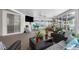 Comfortable sunroom featuring plush seating, sliding glass doors, and calming views of the outdoors at 2585 Waterfall Dr, Spring Hill, FL 34608