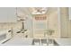 Bright eat-in kitchen featuring standard appliances and a cozy dining area at 2836 Featherstone # 2836, Holiday, FL 34691