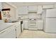 Functional kitchen with standard appliances and ample cabinet space at 2836 Featherstone # 2836, Holiday, FL 34691
