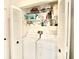 Laundry closet with stacked washer and dryer and shelving at 2836 Featherstone # 2836, Holiday, FL 34691