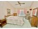 Serene main bedroom retreat with a ceiling fan and soft, neutral colors at 2836 Featherstone # 2836, Holiday, FL 34691