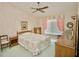 Comfortable bedroom with a ceiling fan, neutral colors, and natural light at 2836 Featherstone # 2836, Holiday, FL 34691